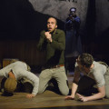 (L-R): CJ (Christopher Livingston), Big Joe (Ian Merrigan), and Coughlin (Jon Beavers) face the horrors of war in The Unfortunates, playing at A.C.T.’s Strand Theater through Sunday, April 10. (Background: Ramiz Monsef). Photo by Kevin Berne.