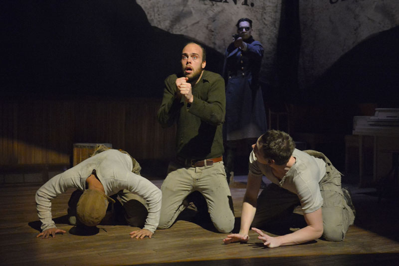 (L-R): CJ (Christopher Livingston), Big Joe (Ian Merrigan), and Coughlin (Jon Beavers) face the horrors of war in The Unfortunates, playing at A.C.T.’s Strand Theater through Sunday, April 10. (Background: Ramiz Monsef). Photo by Kevin Berne.