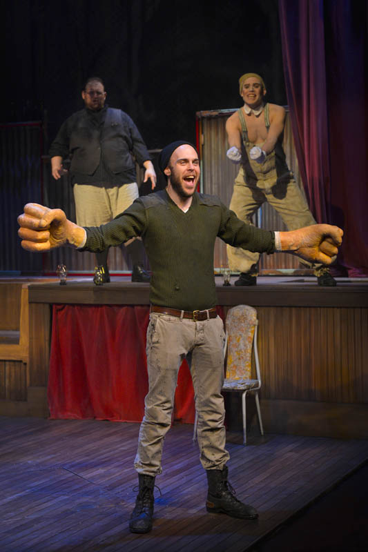 Big Joe (Ian Merrigan) finds his strength—and really big fists—in The Unfortunates, playing at A.C.T.’s Strand Theater through Sunday, April 10. (Background, L-R: Arthur Wise and Eddie Lopez). Photo by Kevin Berne.