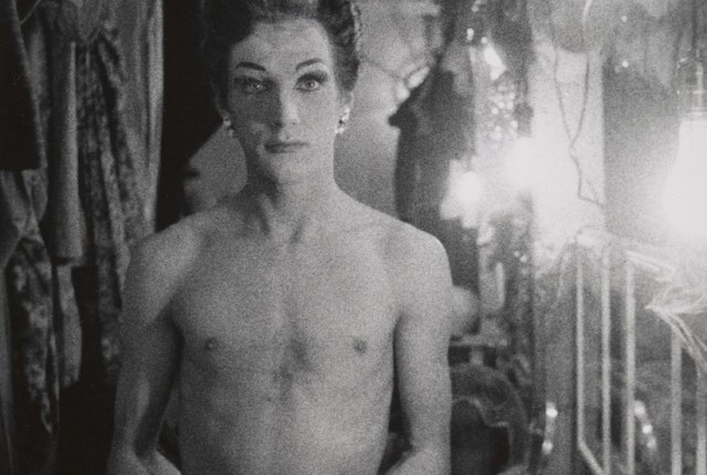 Female impersonator holding long gloves, Hempstead, L.I. 1959