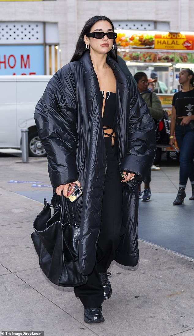 Dua Lipa shows off sense of style for night out with friends... two days  after date with Trevor Noah